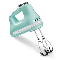 A handheld electric mixer.