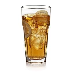 A tall glass filled with ice and tea.