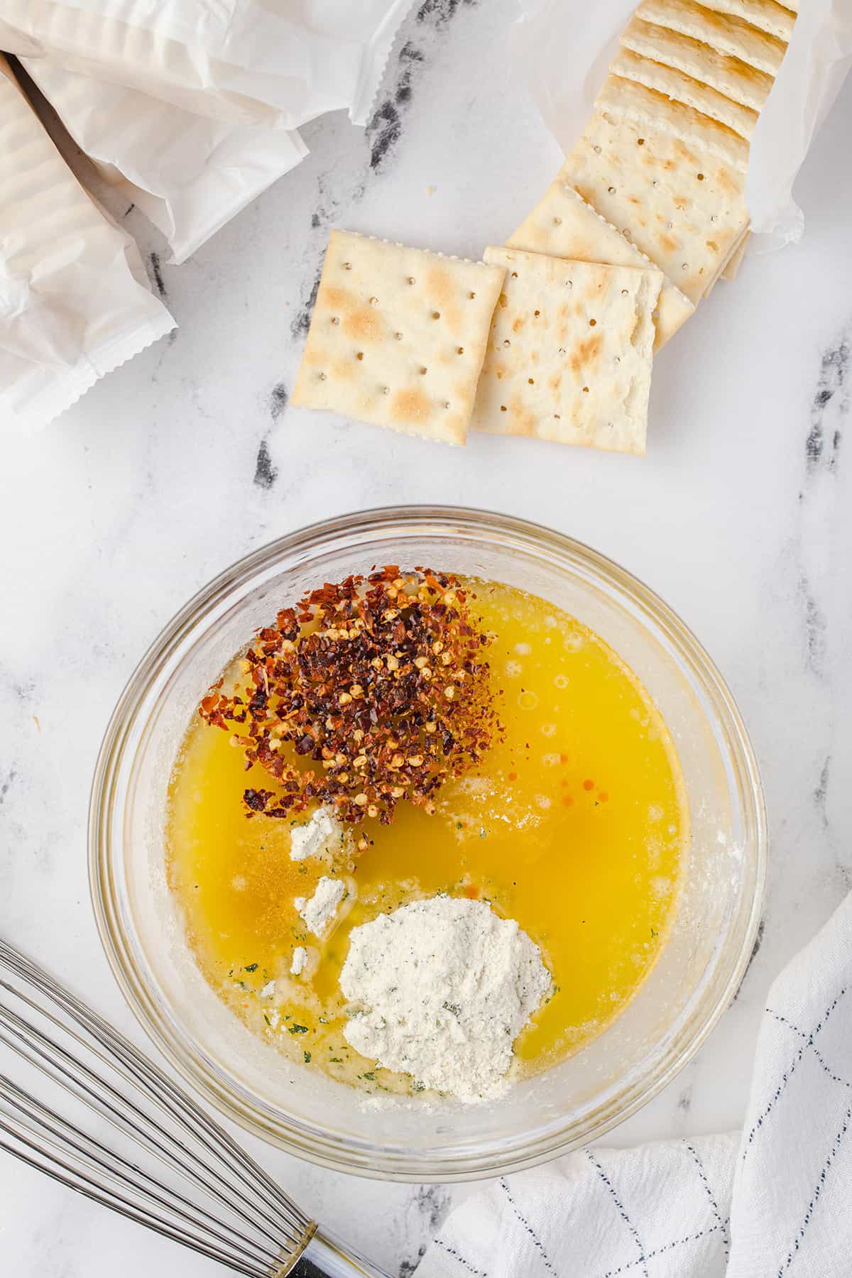 Melted butter and spices in a bowl.