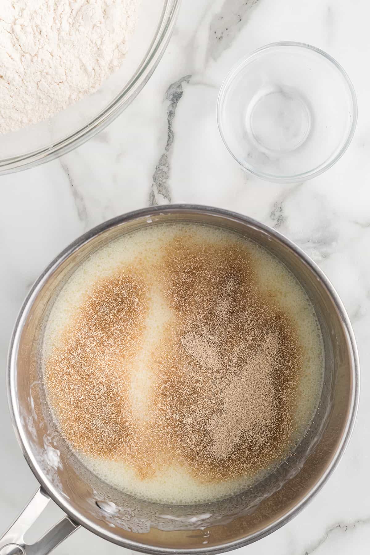 Yeast sprinkled over buttermilk and shortening.