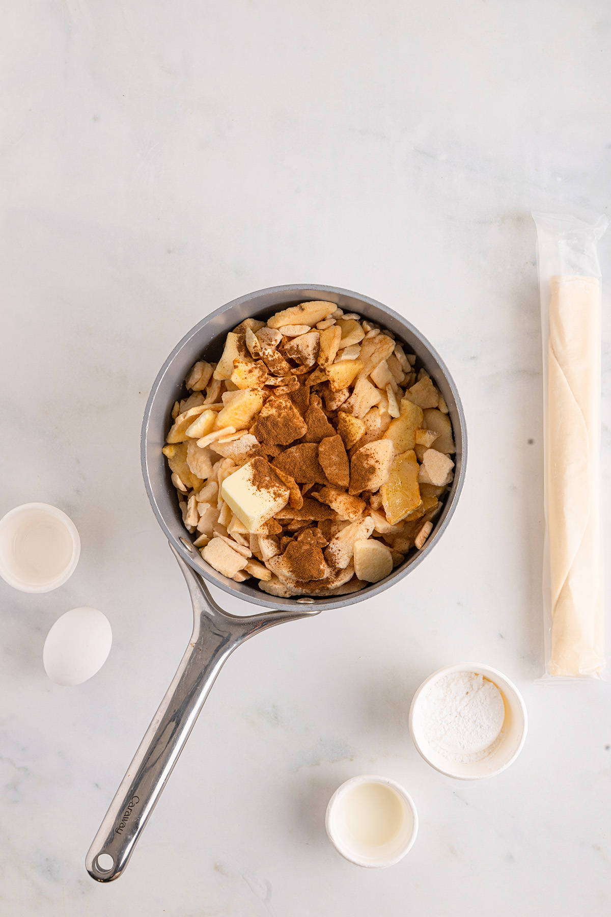 Filling ingredients in a saucepan.