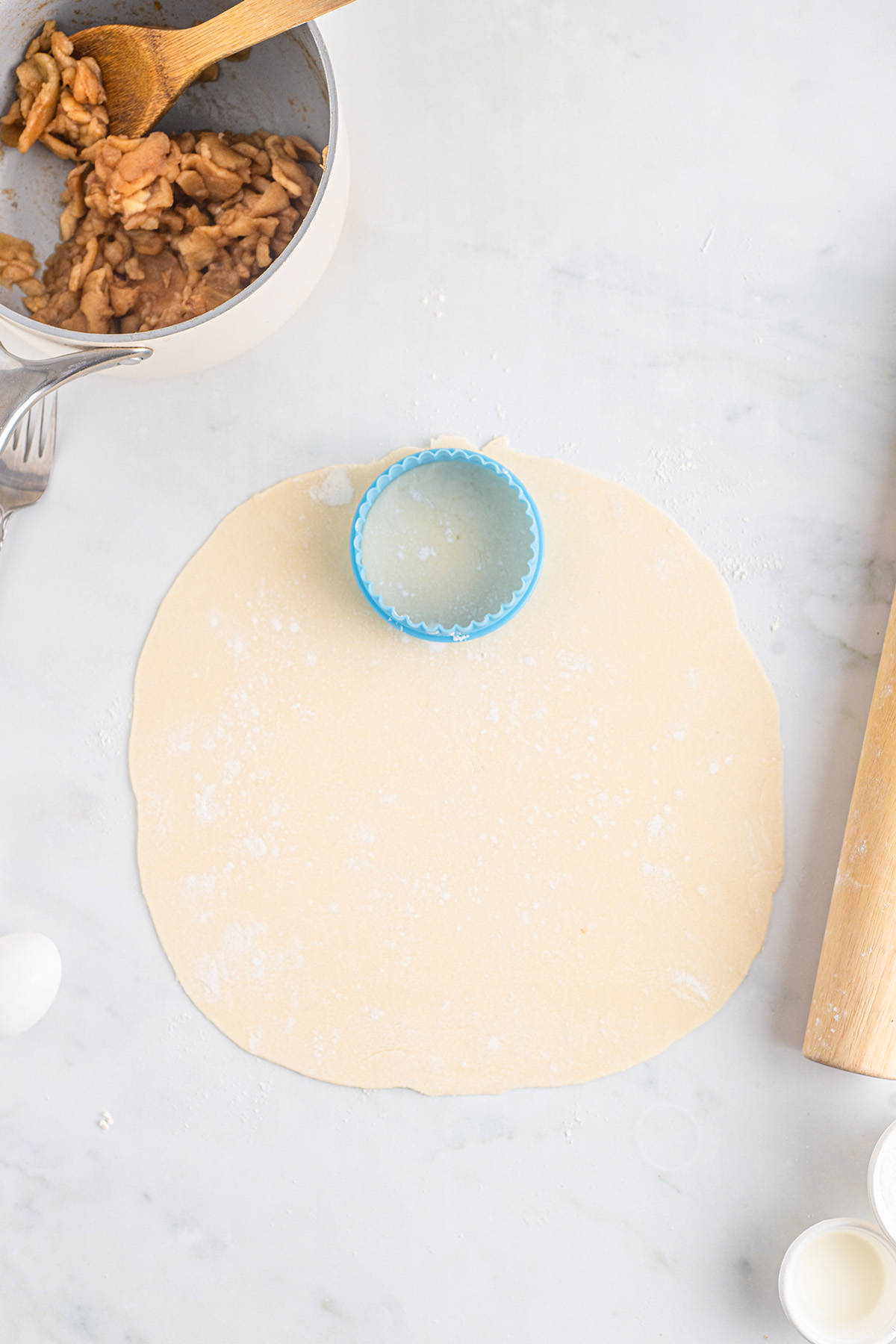 Cutting circles from the pie crust.