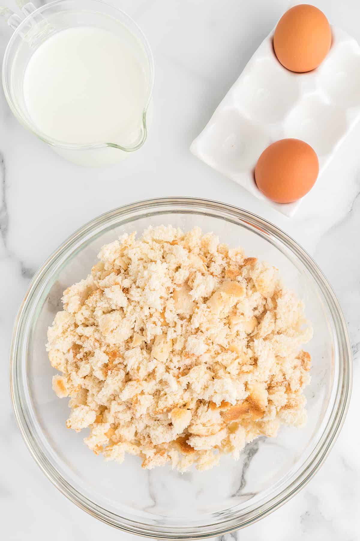 Crumbled biscuits in a mixing bowl.