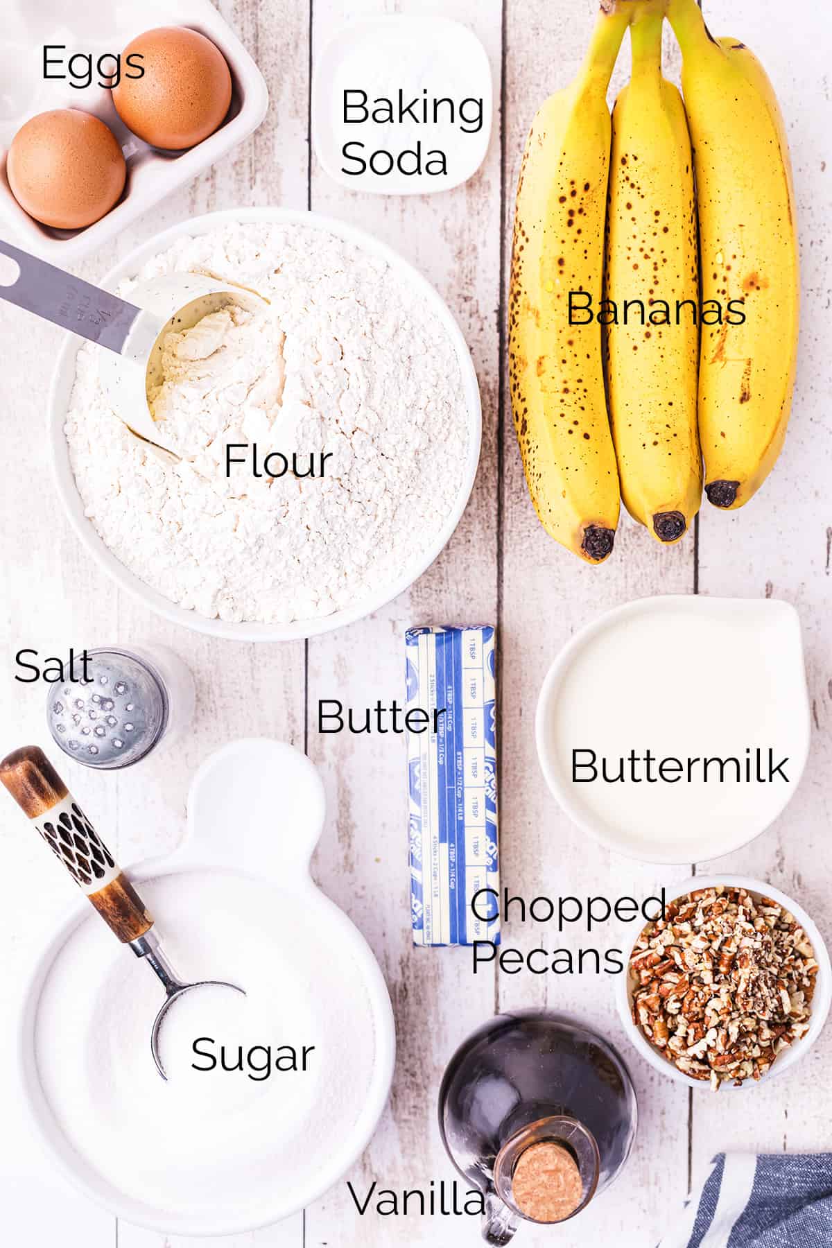 Ingredients needed for Buttermilk Banana Nut Bread: sugar, butter, eggs, flour, baking soda, buttermilk, bananas, pecans, salt, and vanilla extract.