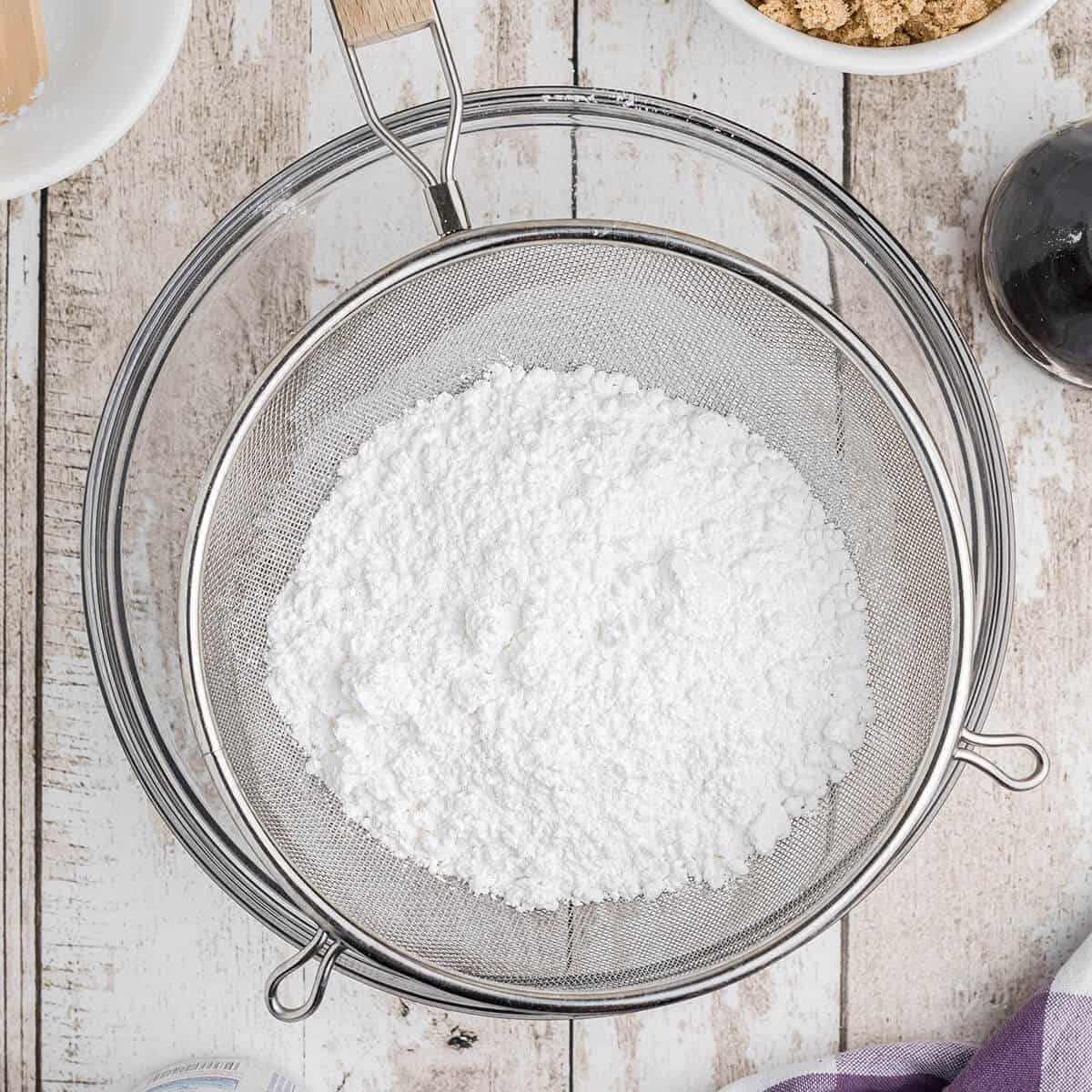 Powdered sugar in a sifter.