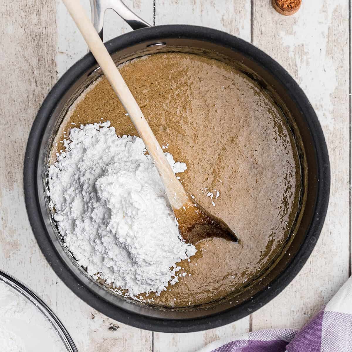 Vanilla and confectioner's sugar added to icing mixture.