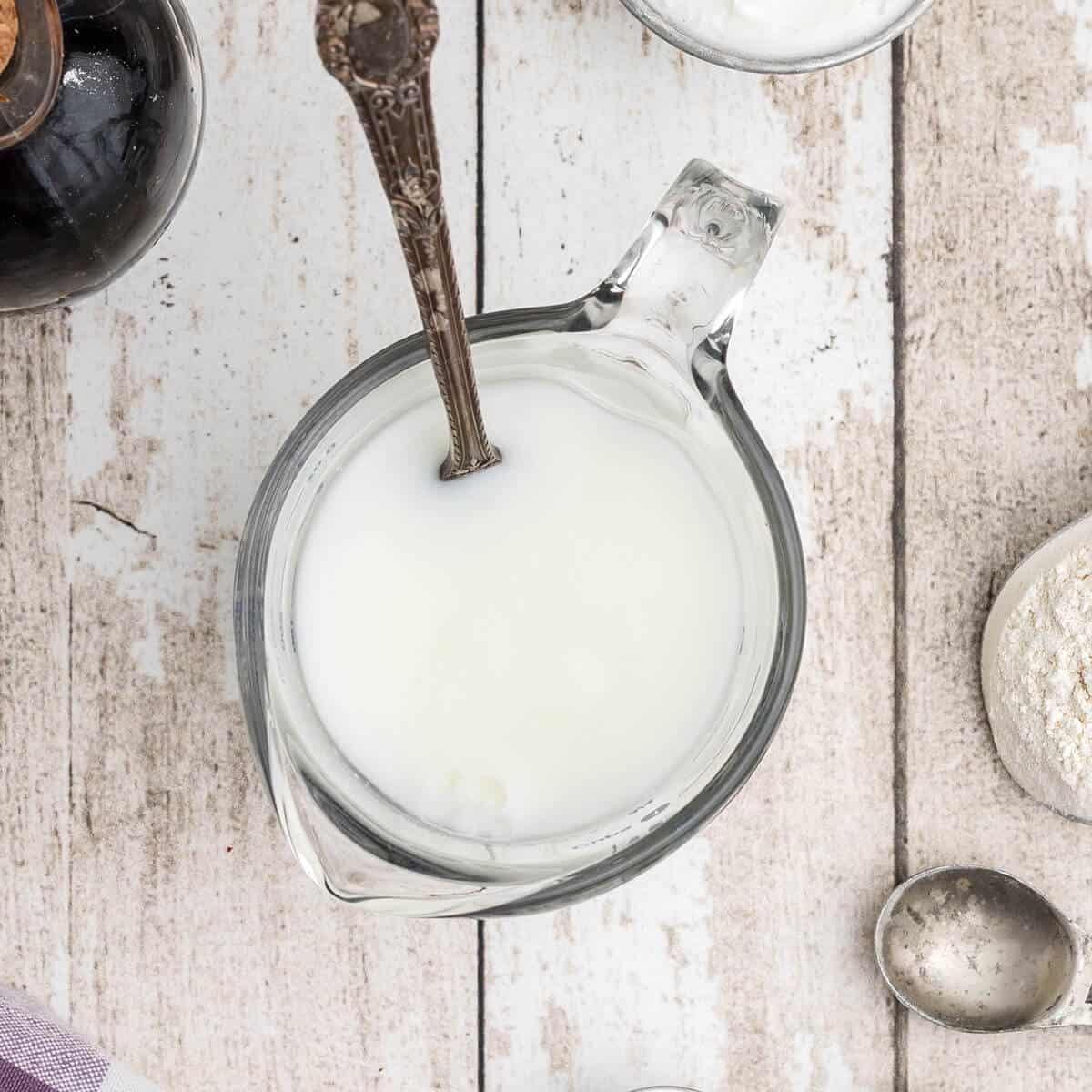 Baking soda and buttermilk in a measuring cup.