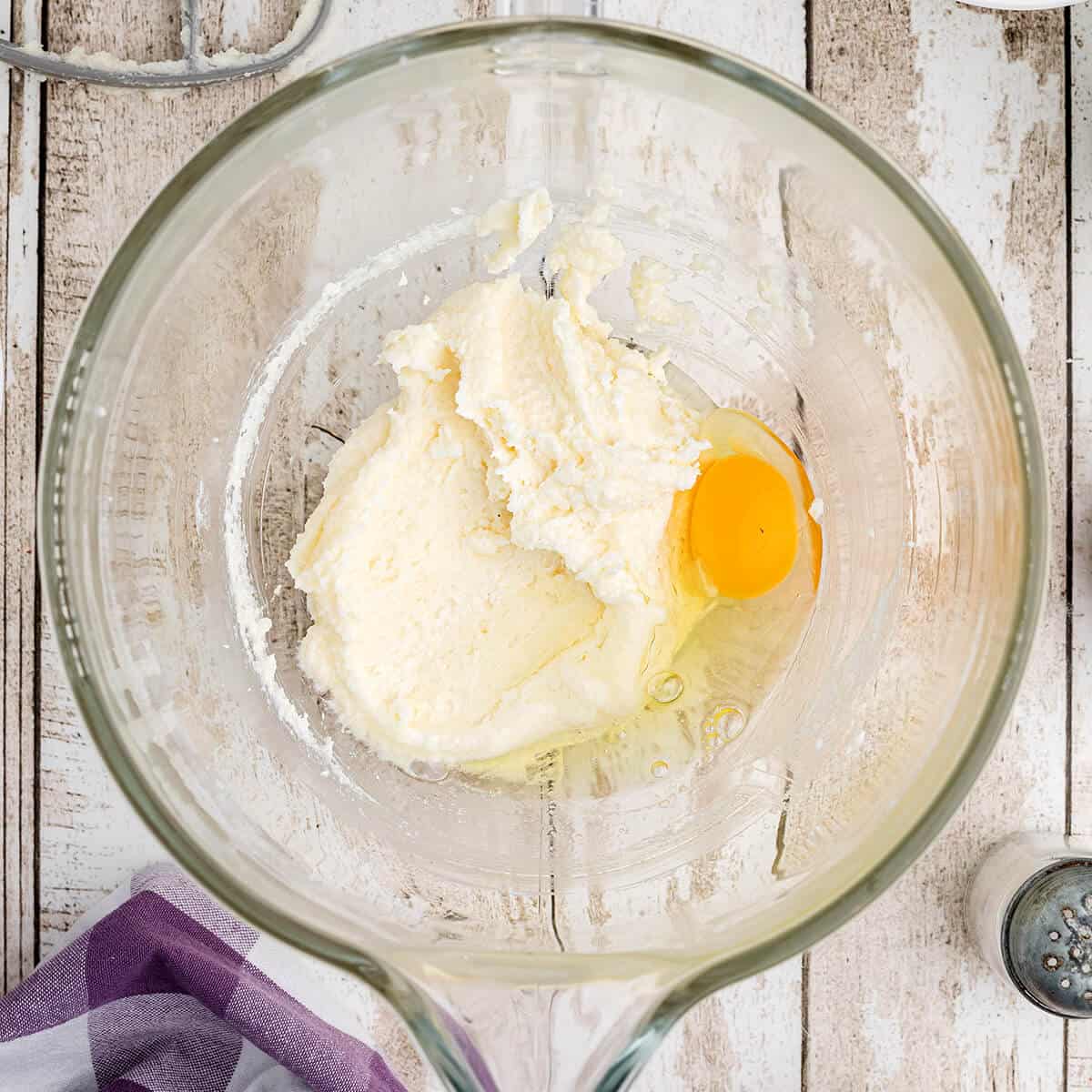 Egg added to butter-sugar mixture.