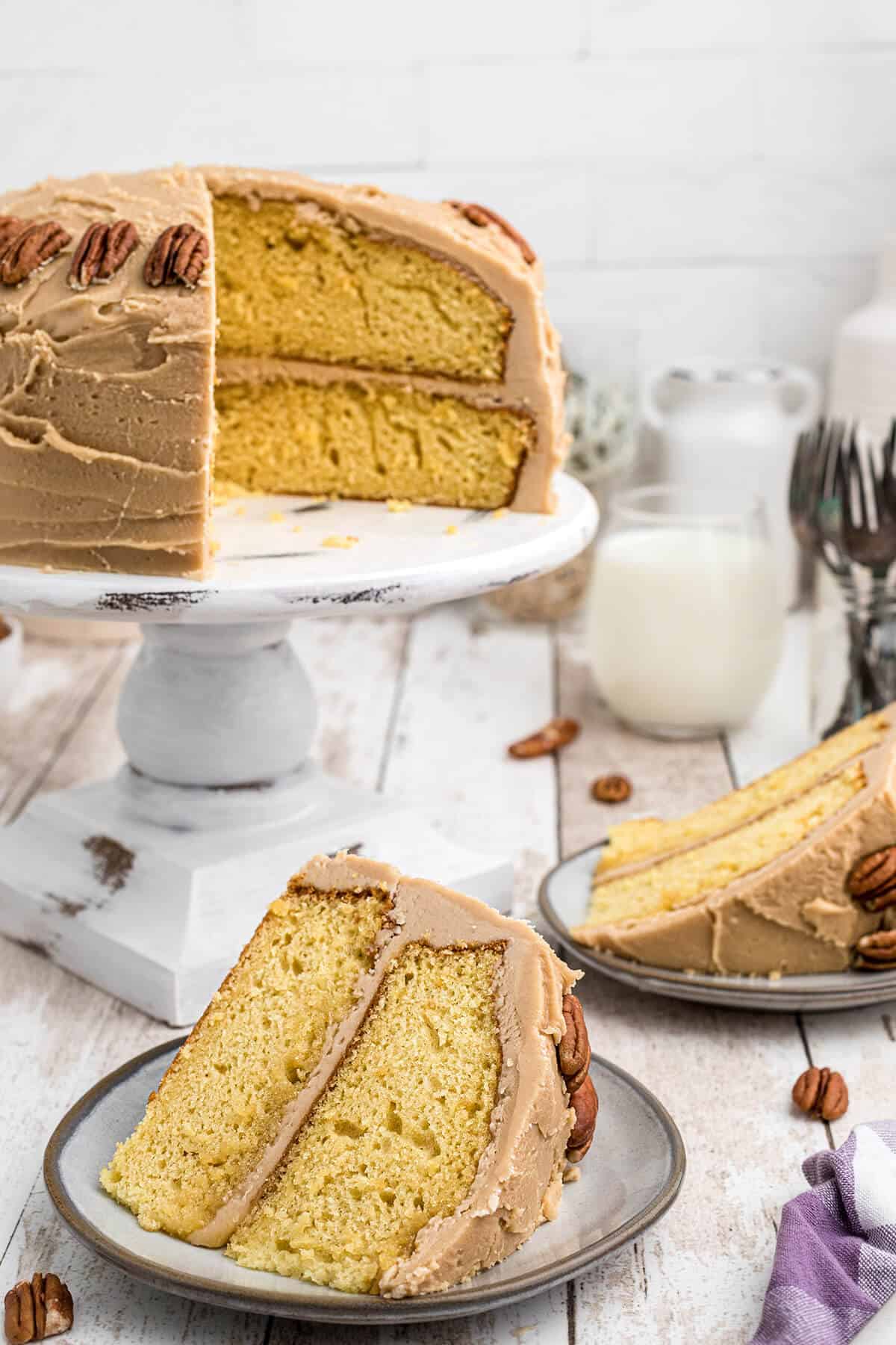 Slices of southern caramel layer cake on serving plates.