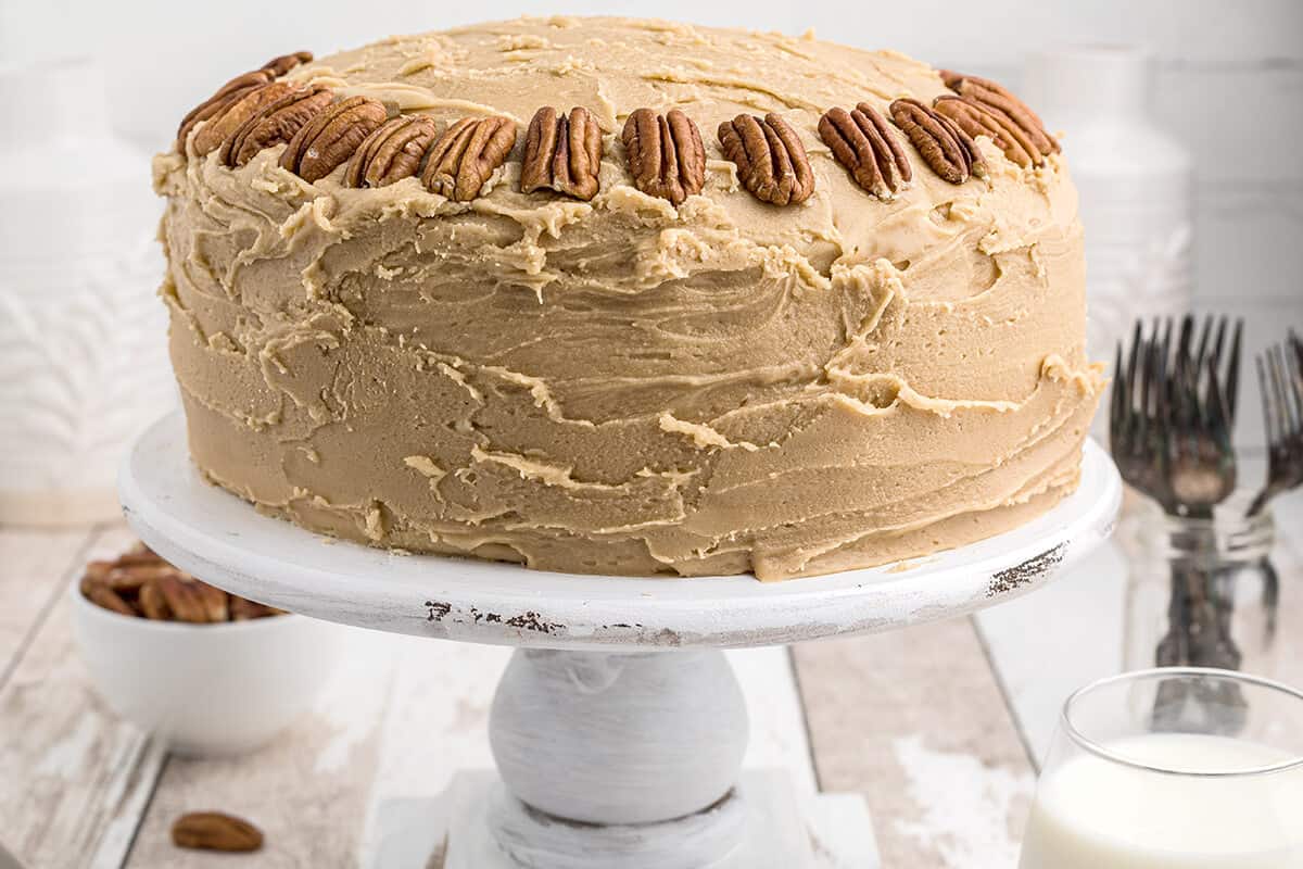 Southern caramel layer cake on a white cake stand.