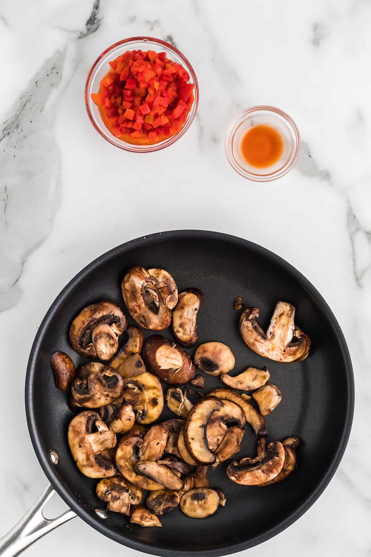 Mushrooms added to butter in the skillet.