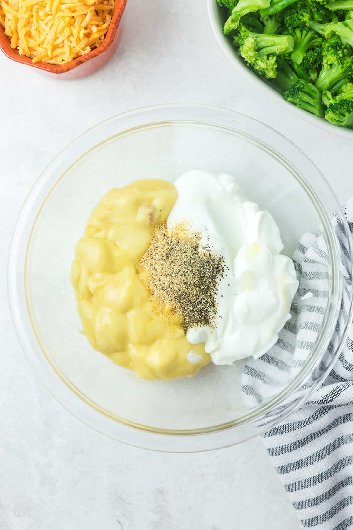 Soup, sour cream, and seasonings in a bowl.