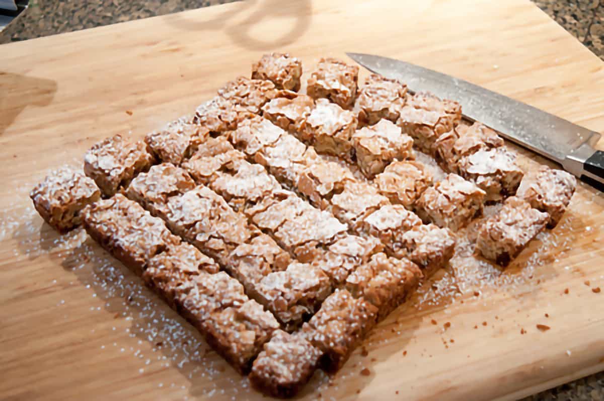 Finished recipe cut into squares on a cutting board.