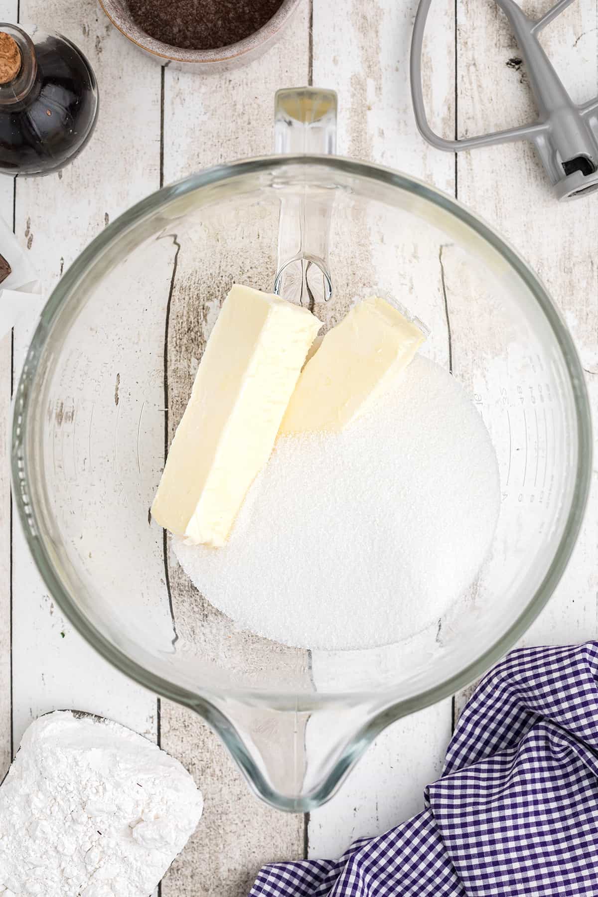 Butter and sugar in a mixing bowl.