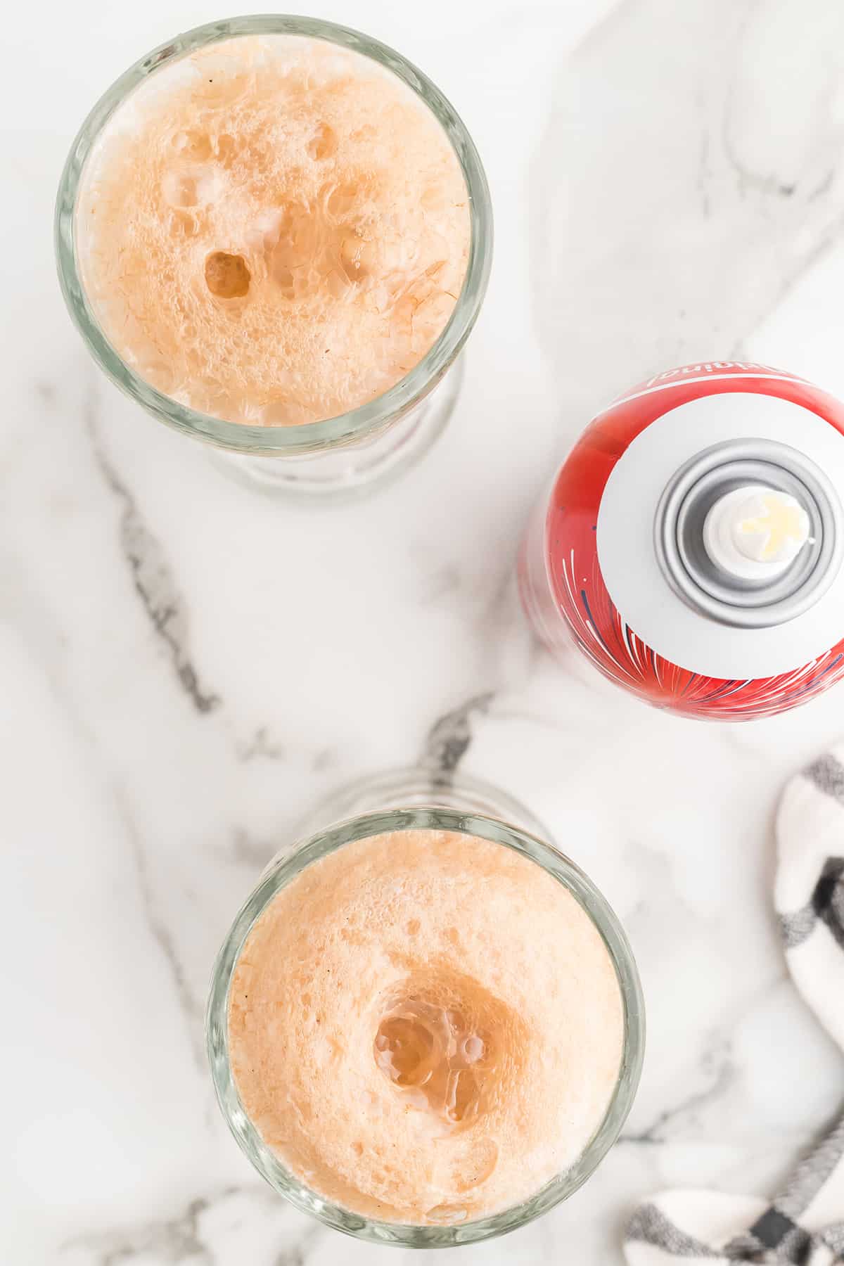 Two glasses with ice cream and coke.