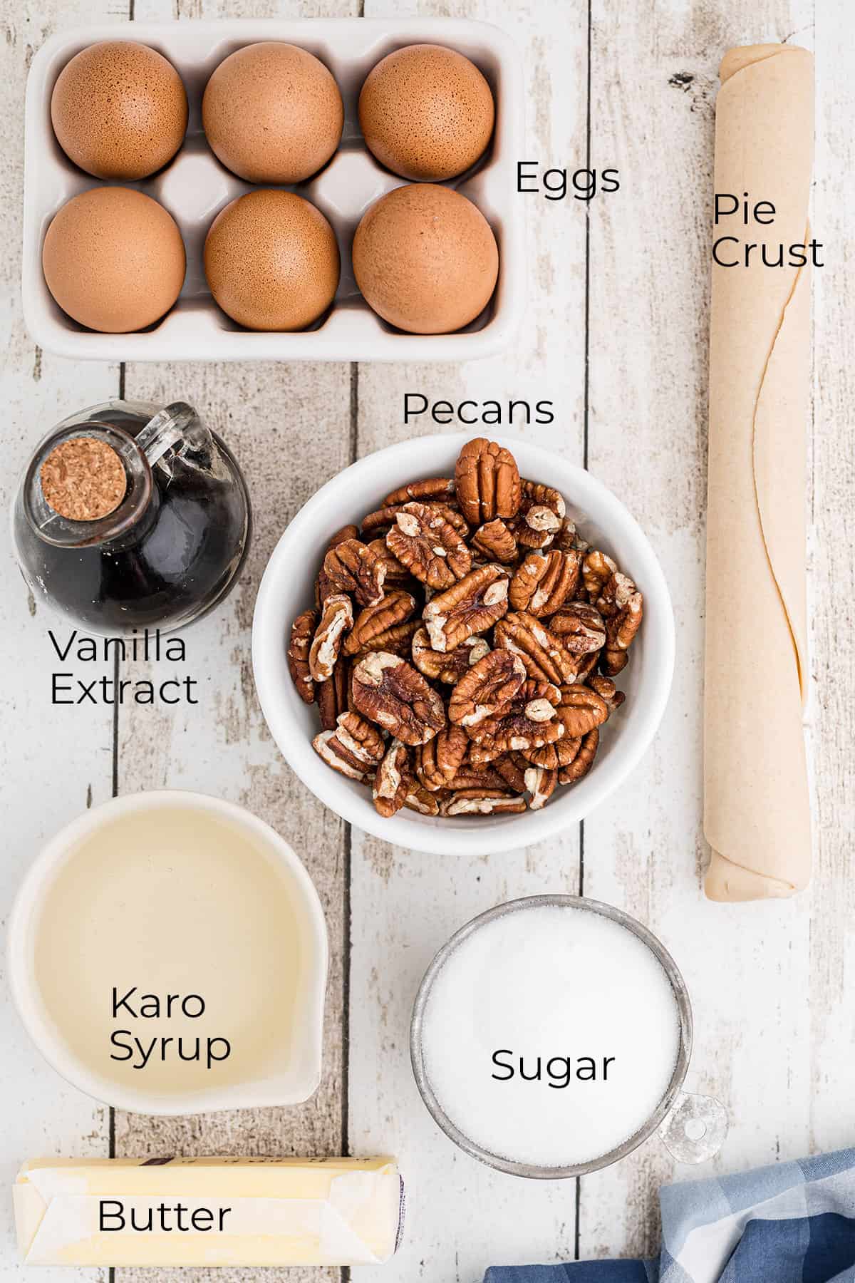 Ingredients needed to make pecan pie.