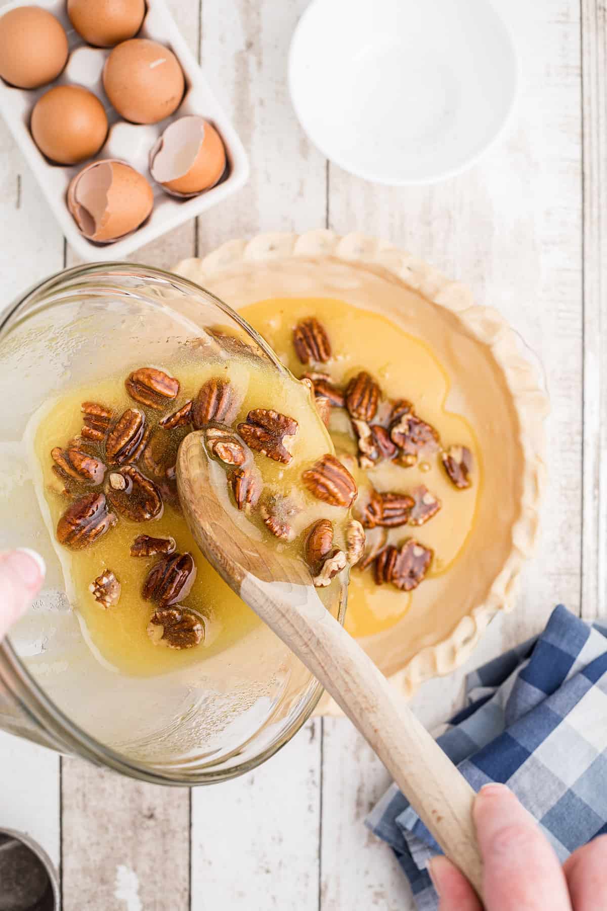 Pouring mixture into a pie shell.