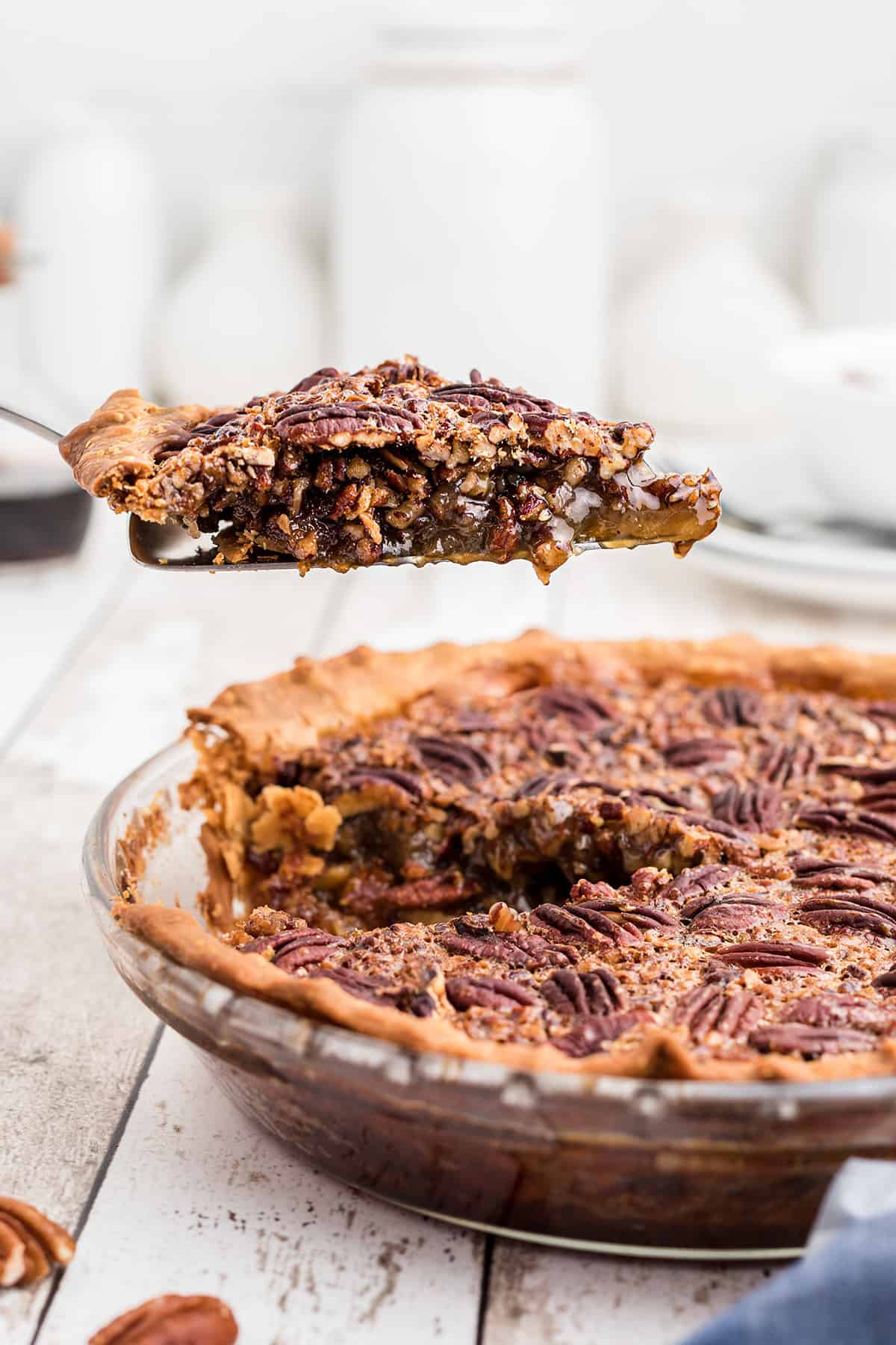 A slice of pie suspended on a spatula.