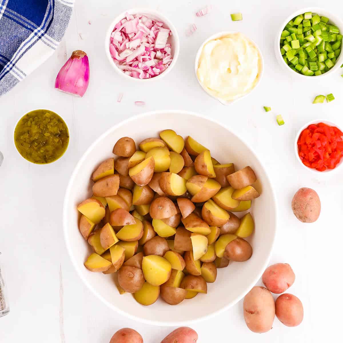 Steamed potatoes in a mixing bowl.