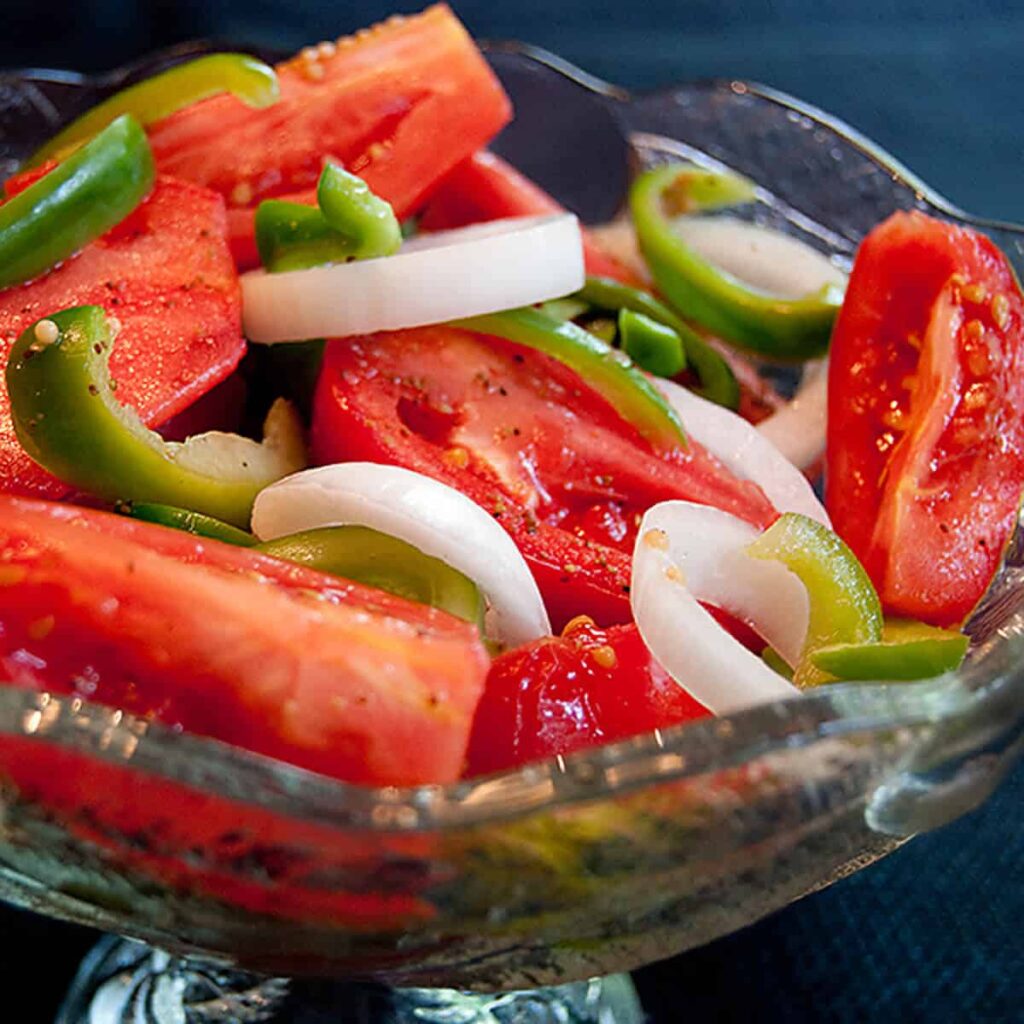 Finished fire and ice tomatoes in a glass serving bowl.