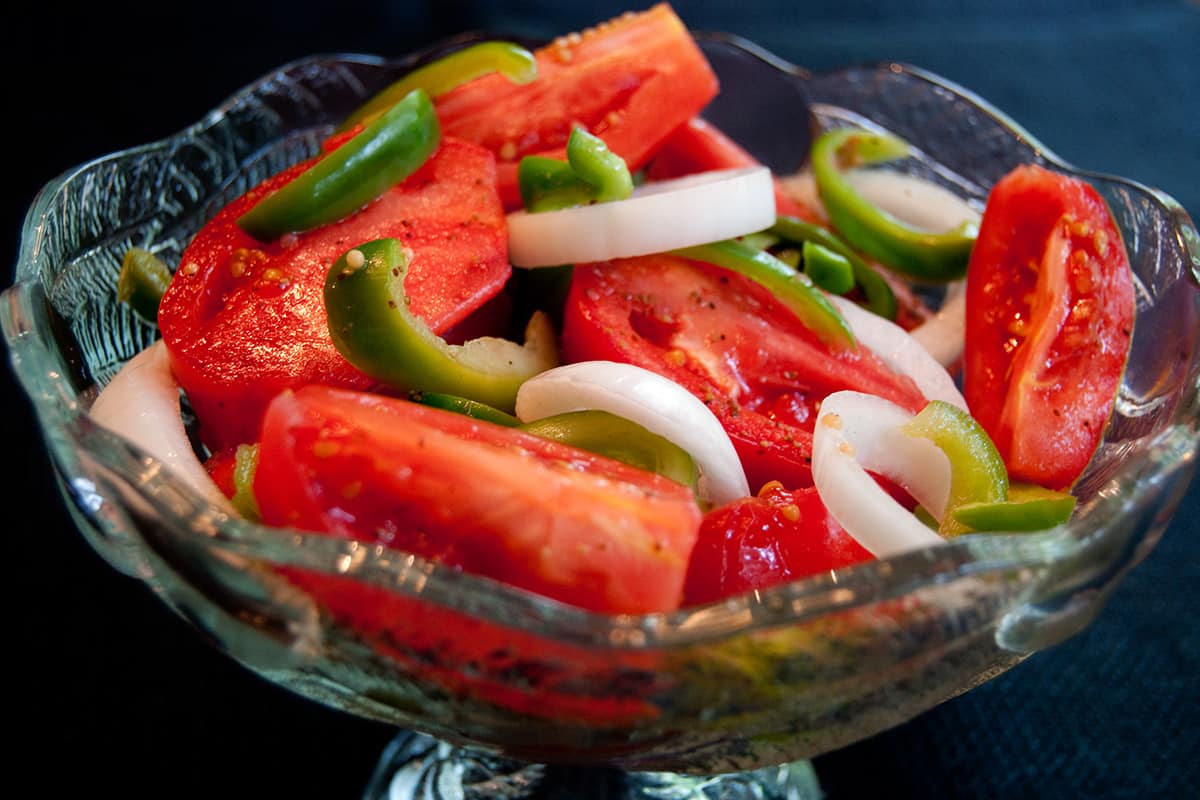 Finished fire and ice tomatoes in a glass serving bowl.