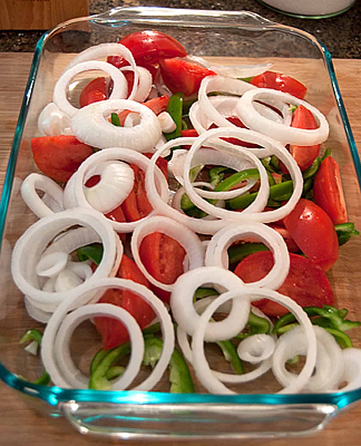 Vegetables layered in a shallow dish.