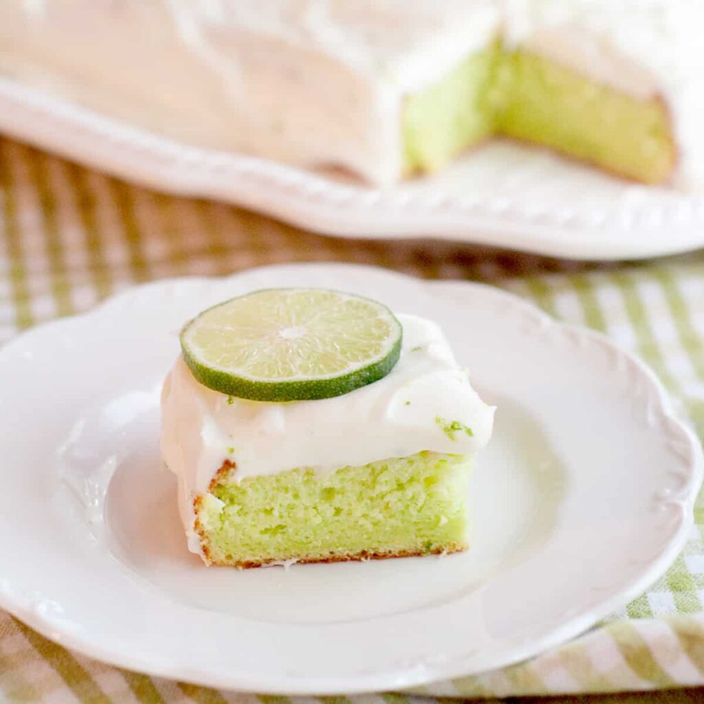 A serving of cake on a white plate.