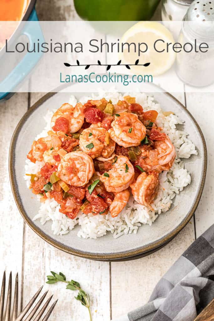 A serving of Louisiana Shrimp Creole over white rice on a plate.