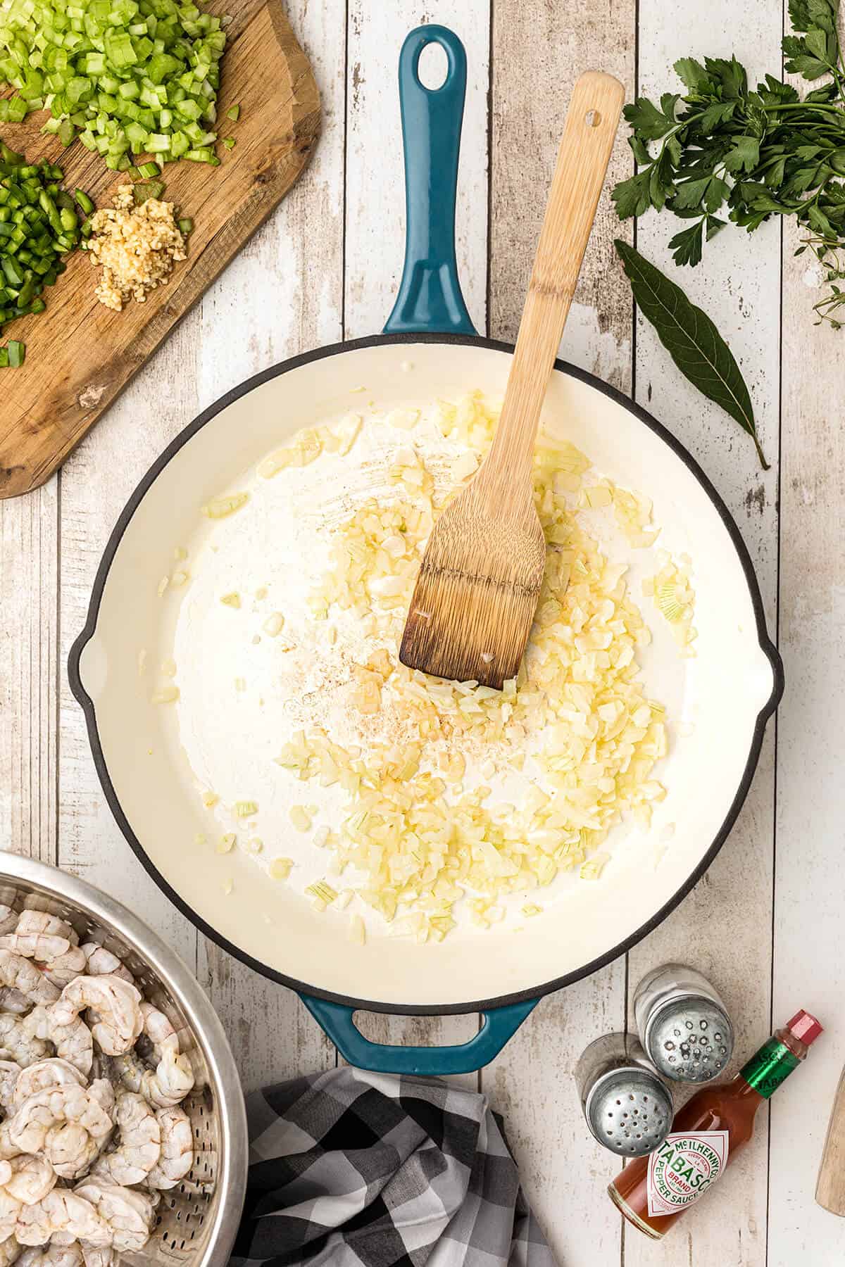 Onions and butter cooking in a skillet.