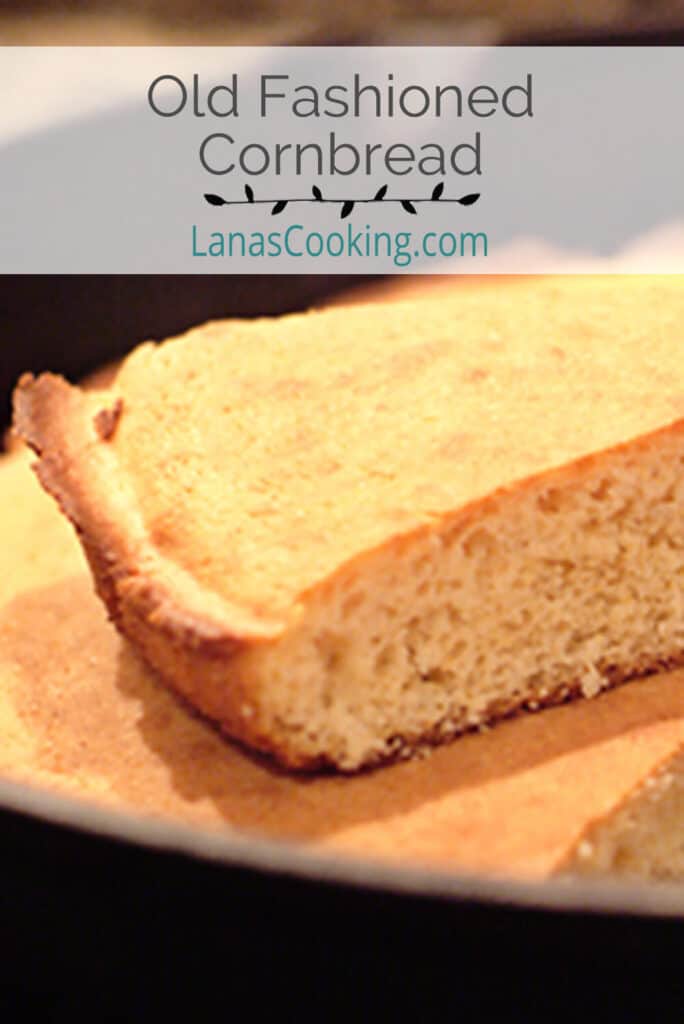 A slice of cornbread on top of a skillet.