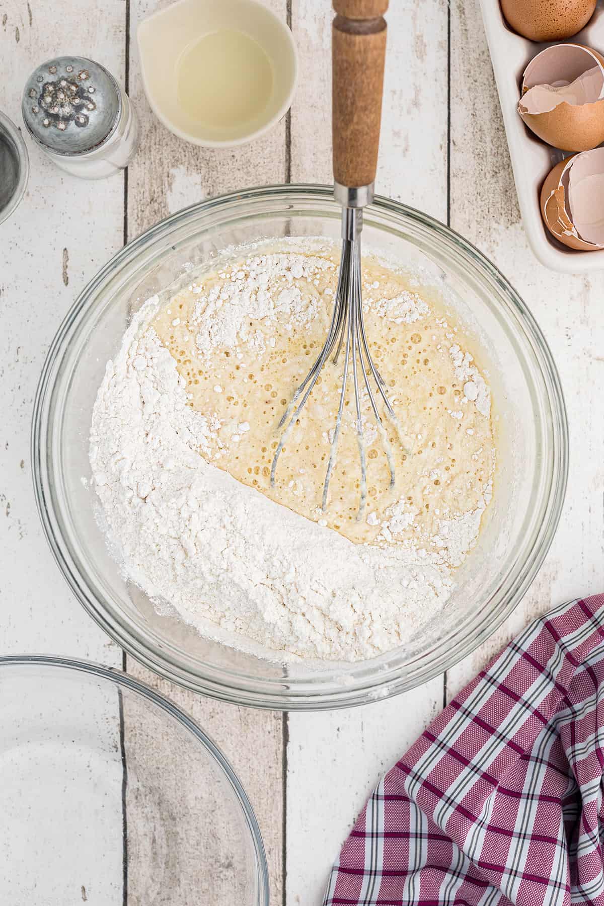 Wet and dry ingredients combined in a bowl.