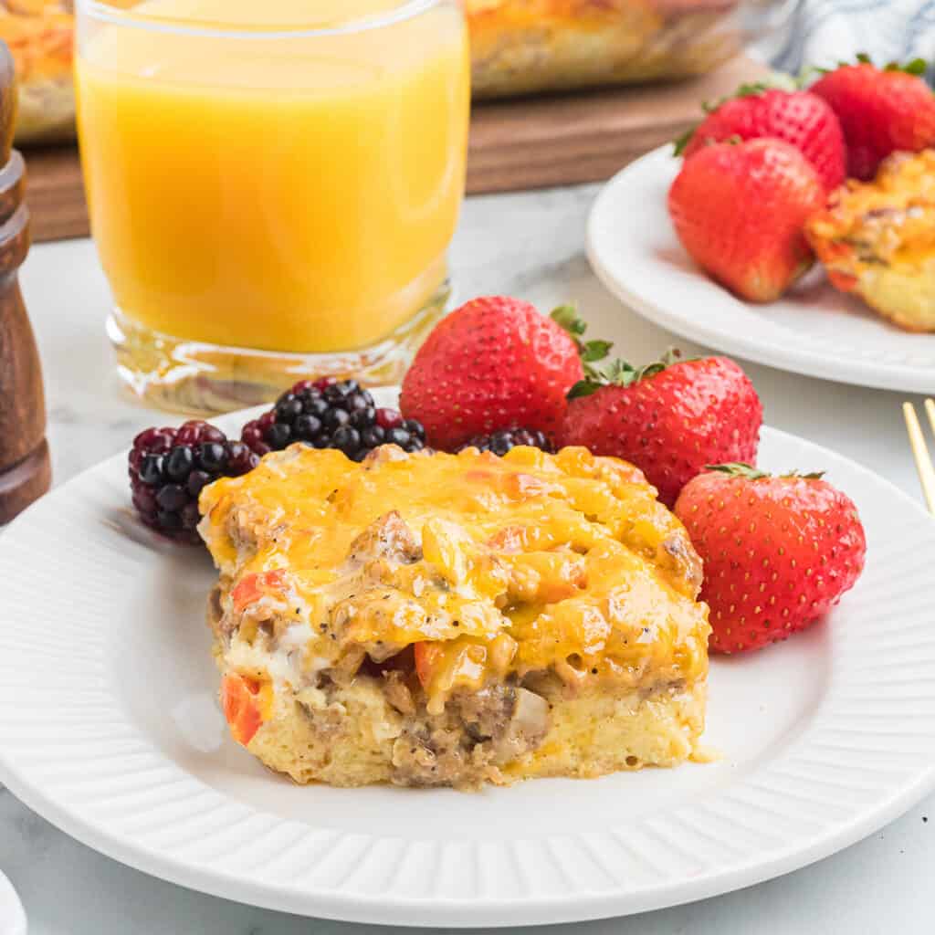 A serving of breakfast casserole on a white plate.