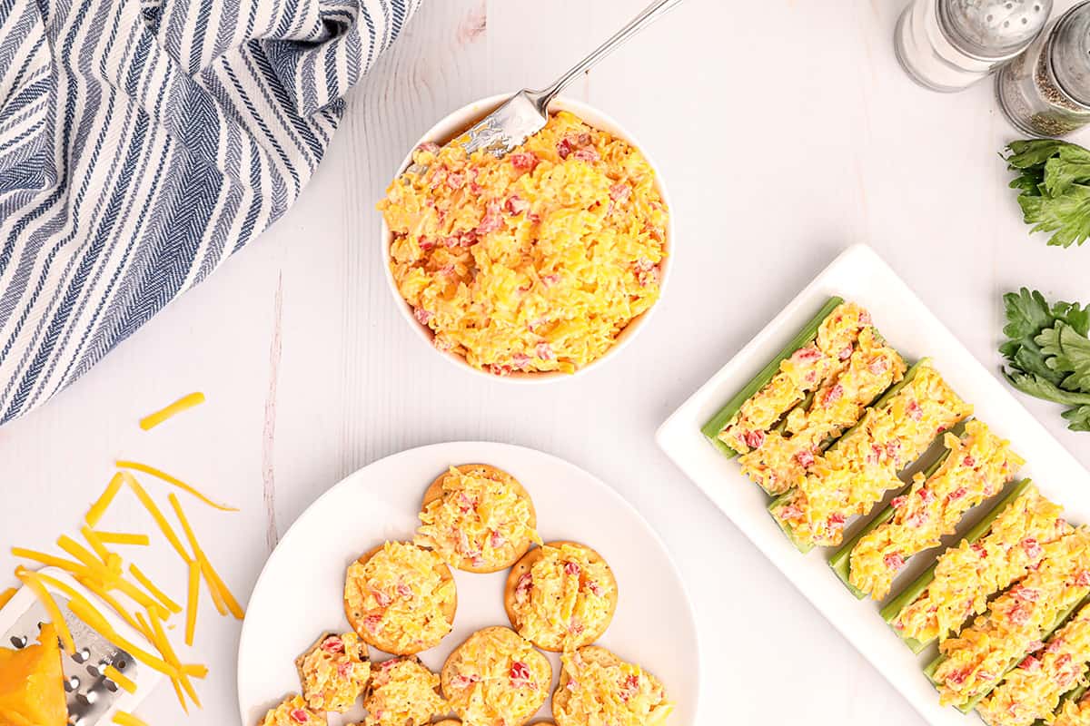 Pimiento cheese on crackers, on celery, and in a bowl.