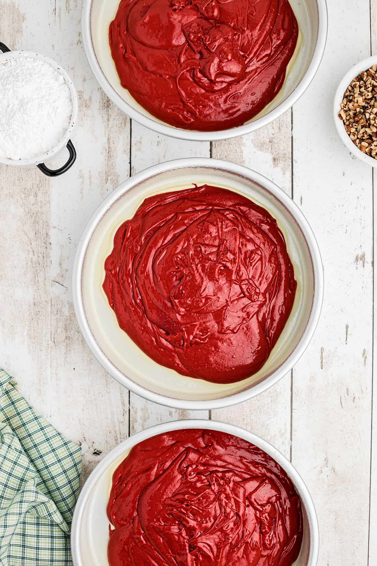 Batter poured into three prepared pans.