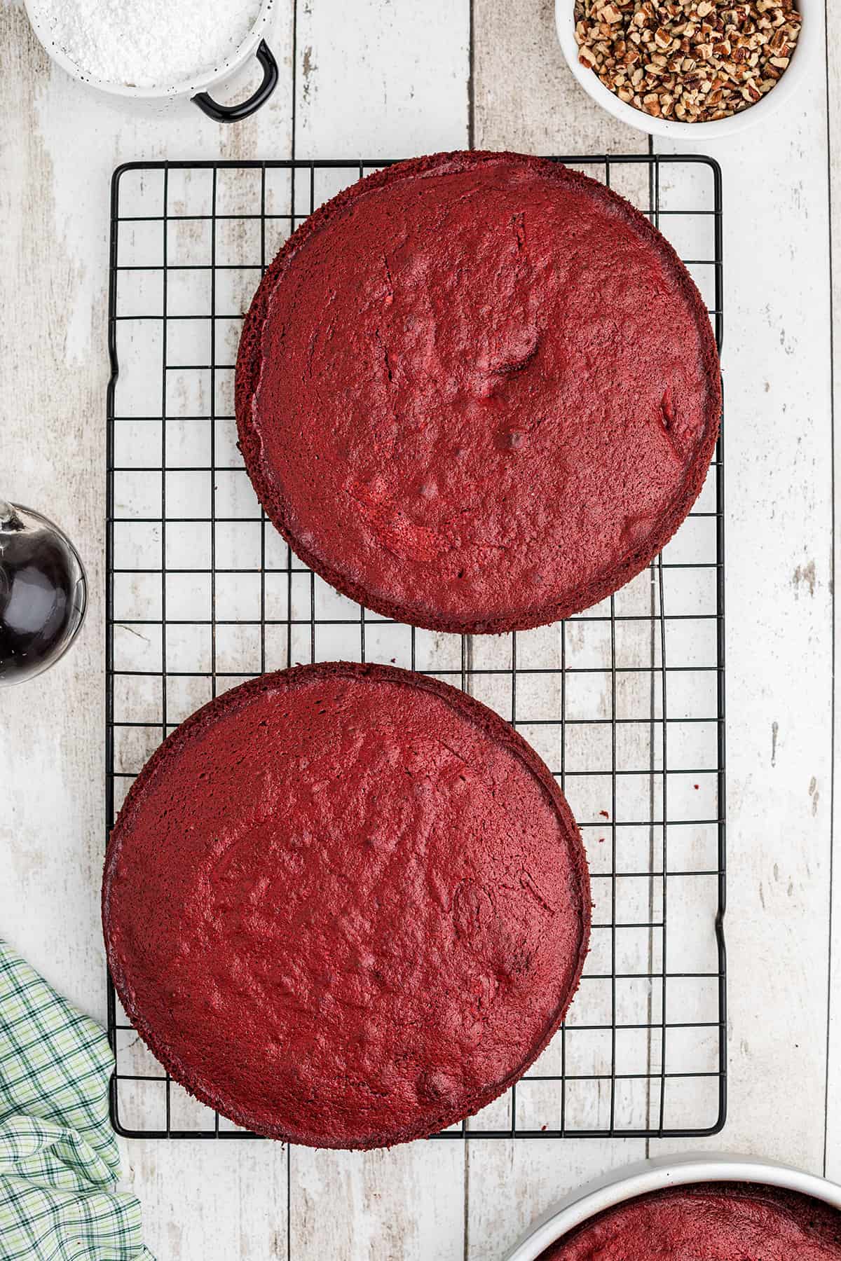 Cake layers cooling on a baking rack.