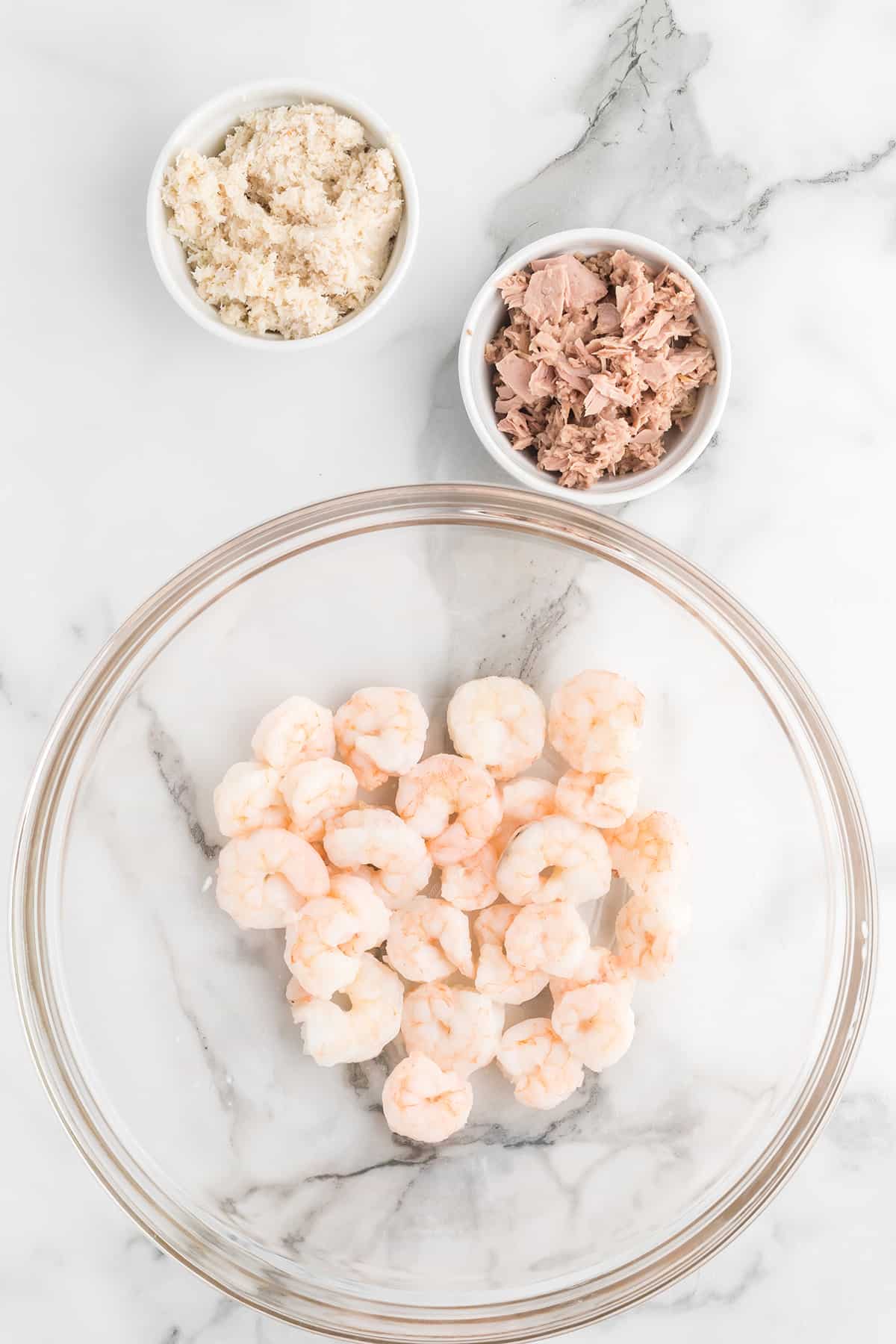 Cooked shrimp in a mixing bowl.