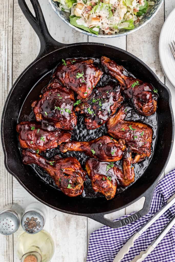 Finished chicken in a skillet.