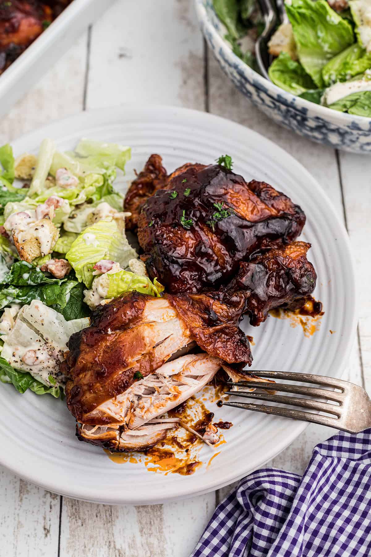 Finished chicken arranged on a white serving platter.