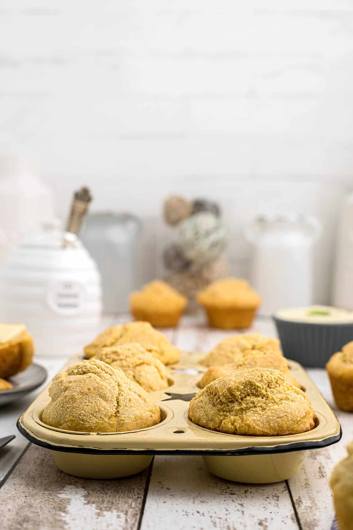 Finished muffins in a baking tin.