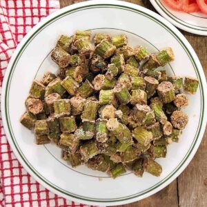 A plate heaped with golden brown fried okra.