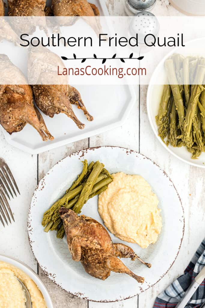 A serving of fried quail on a plate with cheese grits and asparagus.