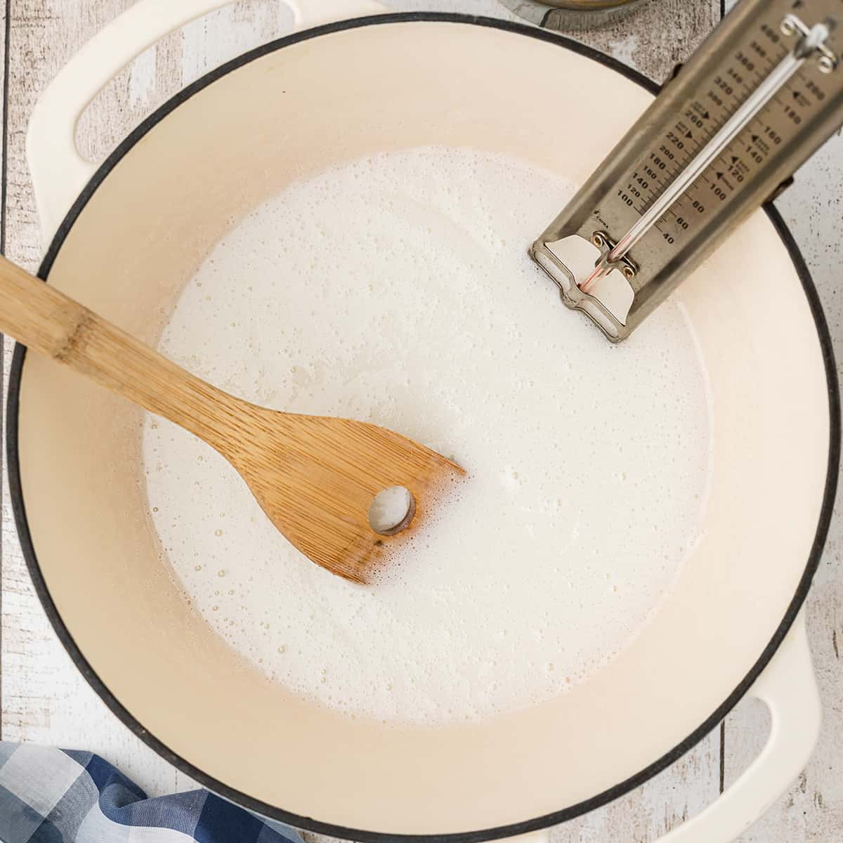 Saucepan with candy thermometer attached.