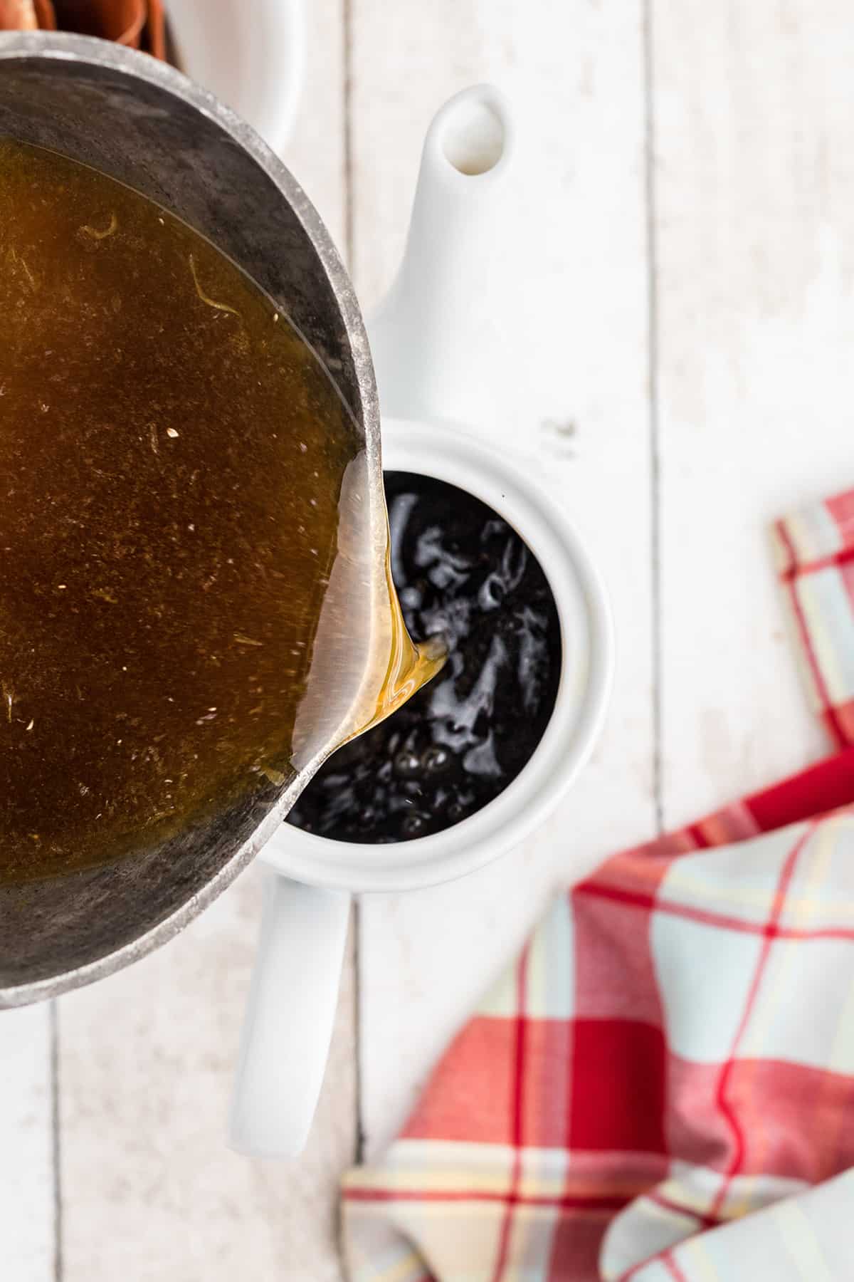 Pouring the infusion into the brewed tea.