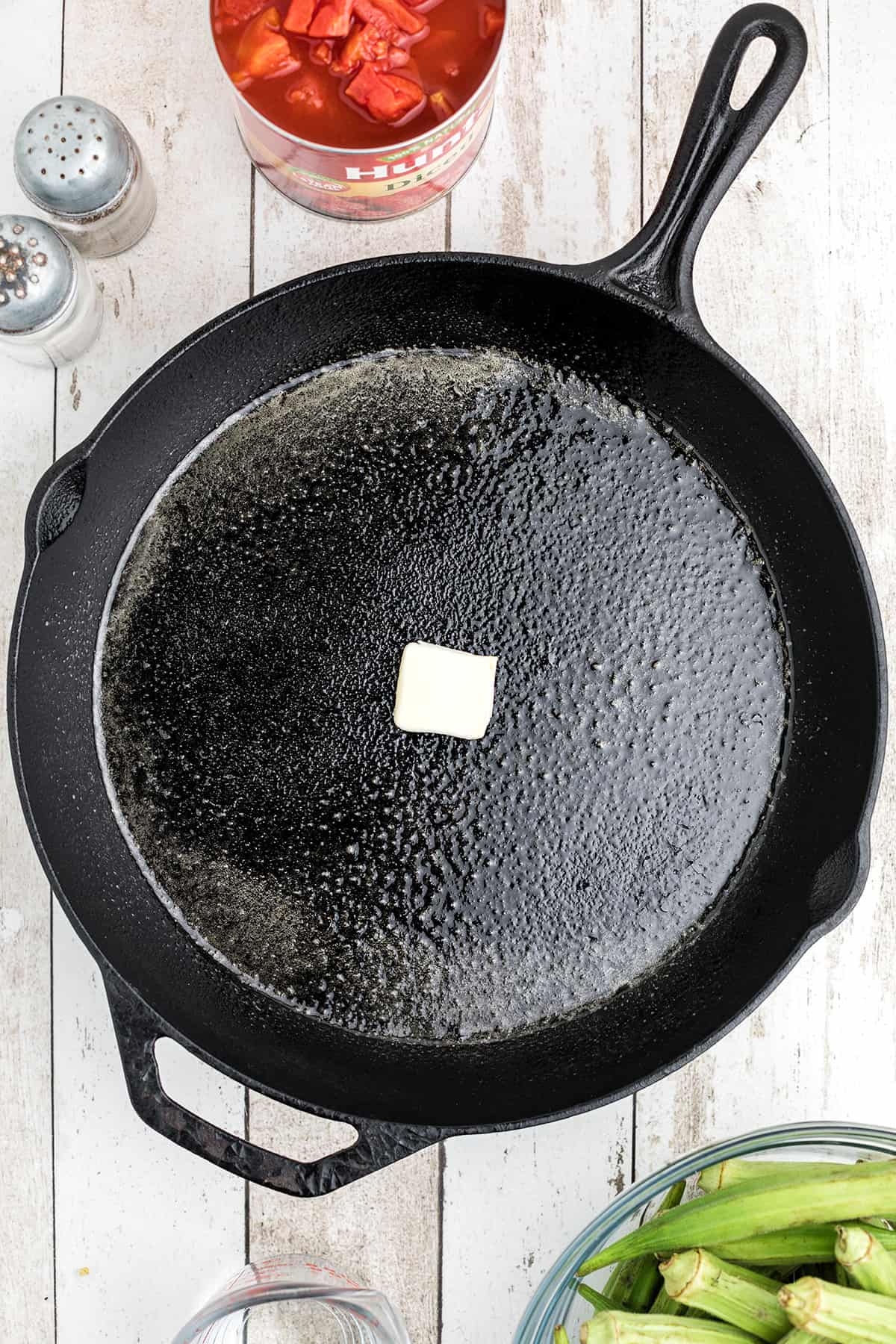 Butter melting in a cast iron skillet.