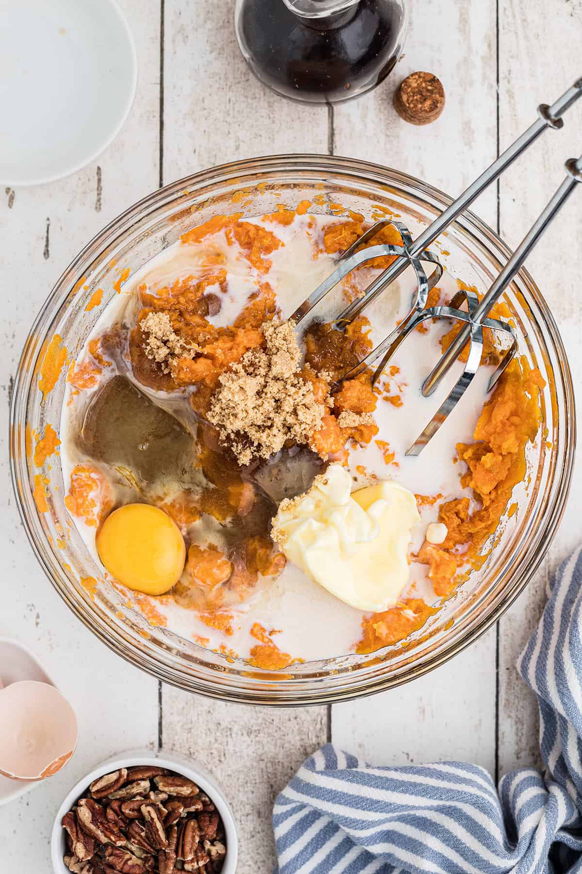 Ingredients for the sweet potato layer in a mixing bowl.