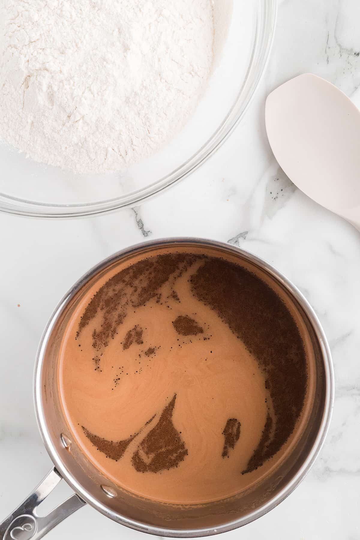 Butter, shortening, cocoa and water melted in a saucepan.