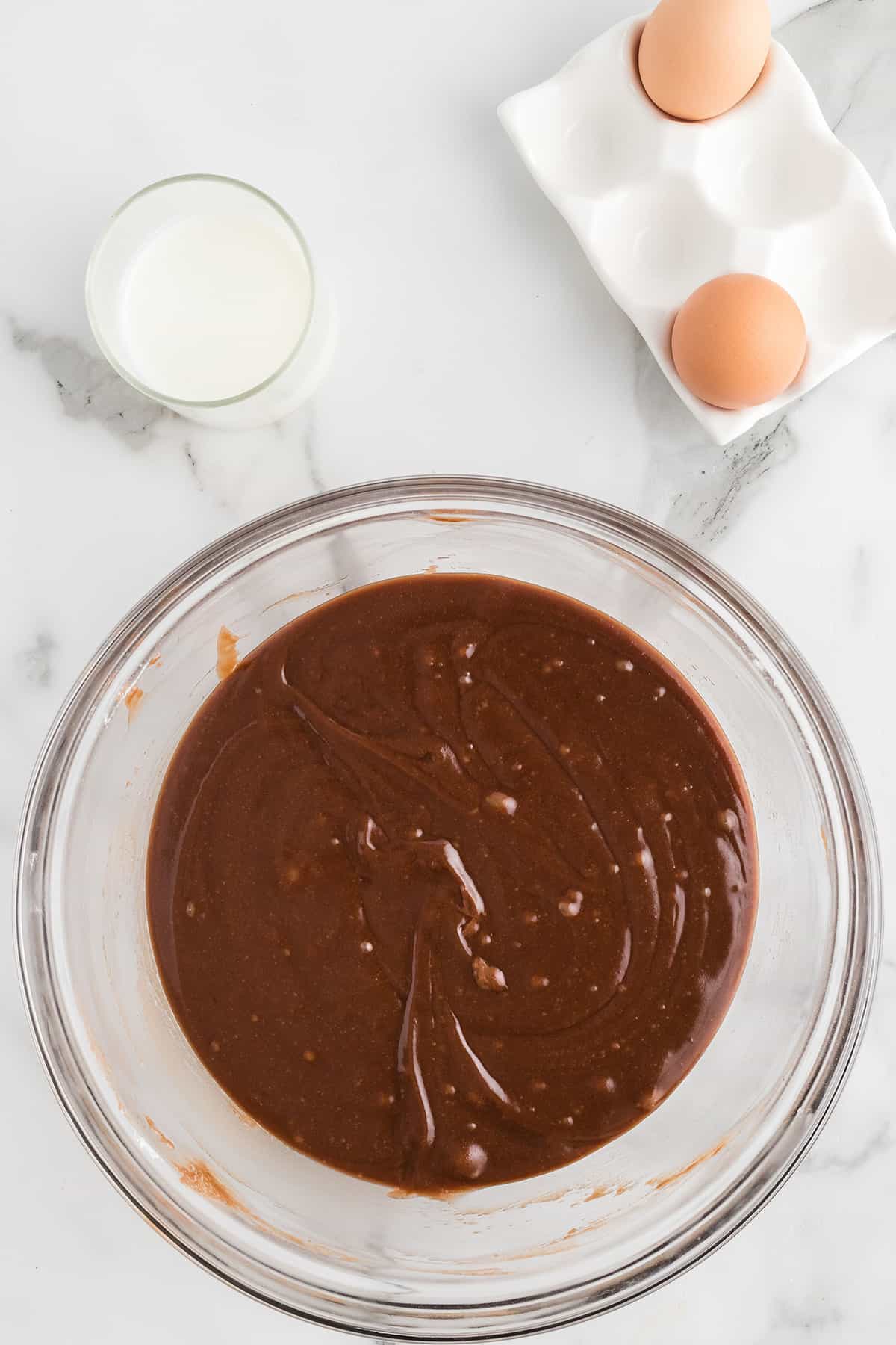 Cocoa mixture poured over sugar and flour mixture.