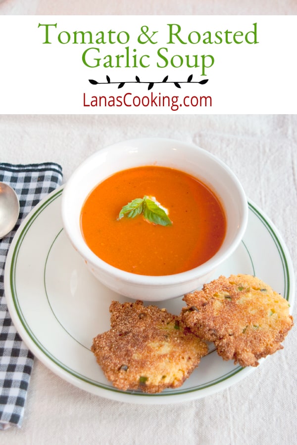 Tomato and Roasted Garlic Soup is a classic tomato soup recipe with the addition of roasted garlic. Perfect for dipping with a grilled cheese sandwich. https://www.lanascooking.com/tomato-roasted-garlic-soup